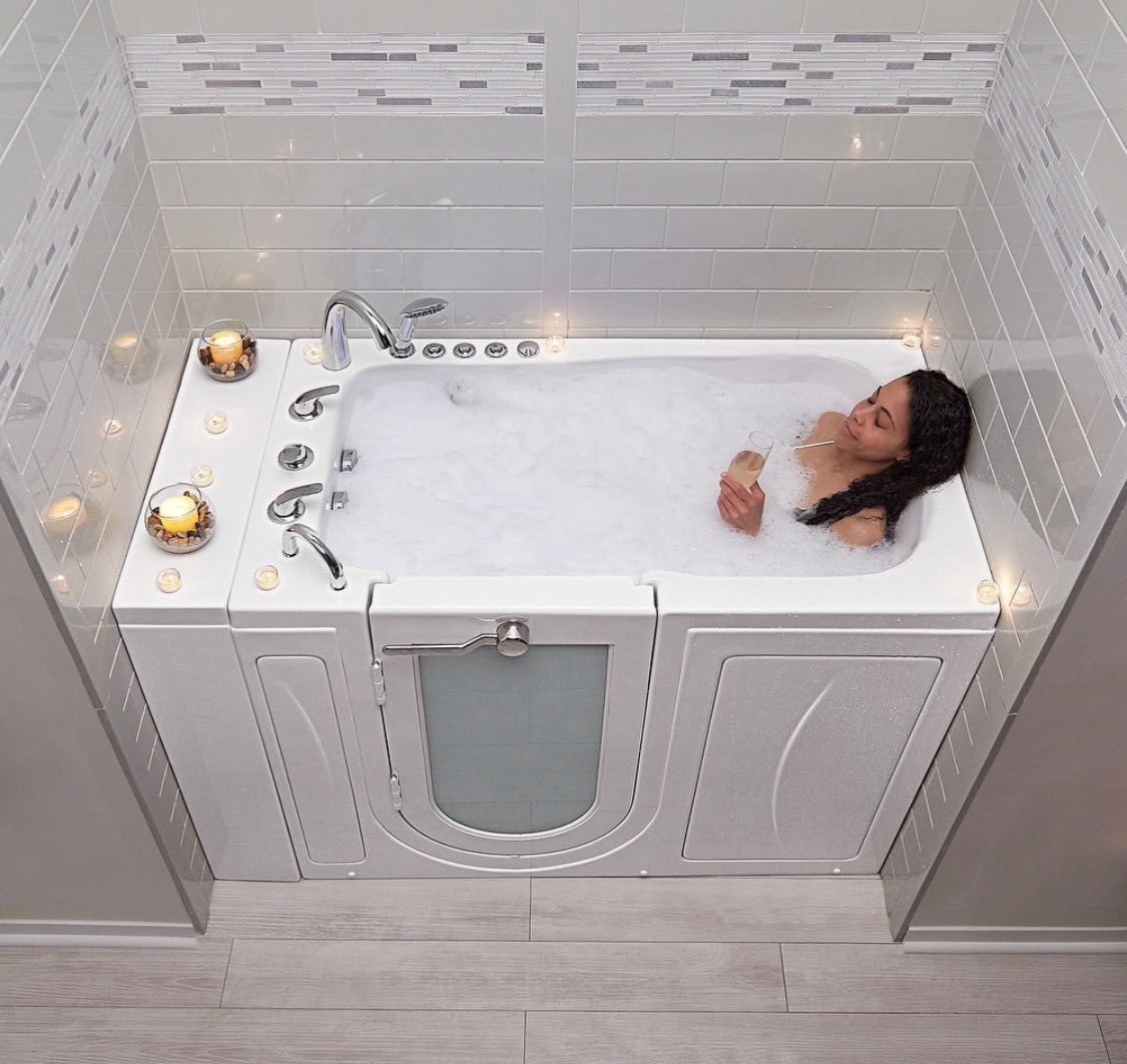 Hydrotherapy jetted walk-in tub with transfer door